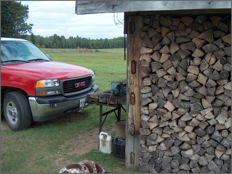Wood Pile and Uncles Truck.jpg
